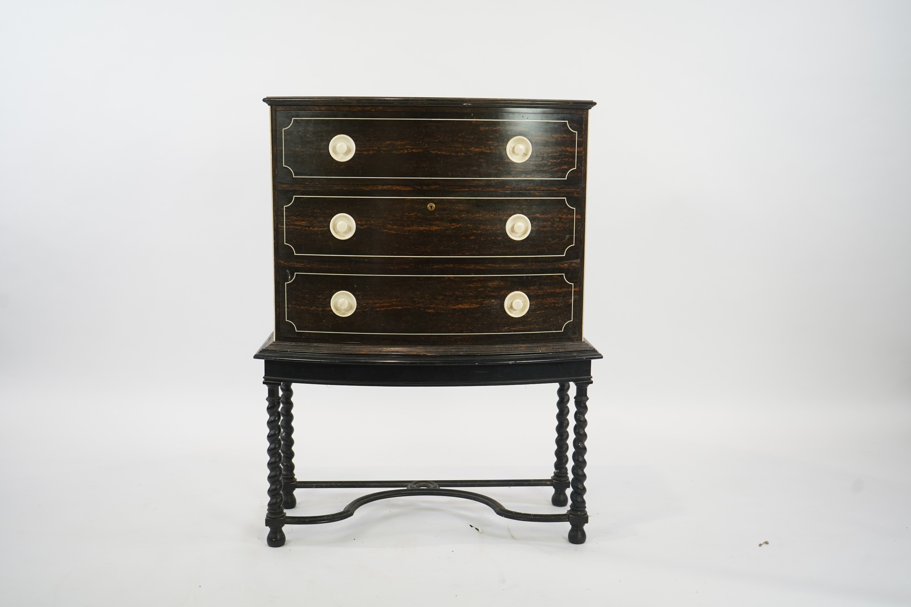 An early 20th century ivory mounted coromandel three drawer bowfront chest, stamped Callow of Mount Street, London